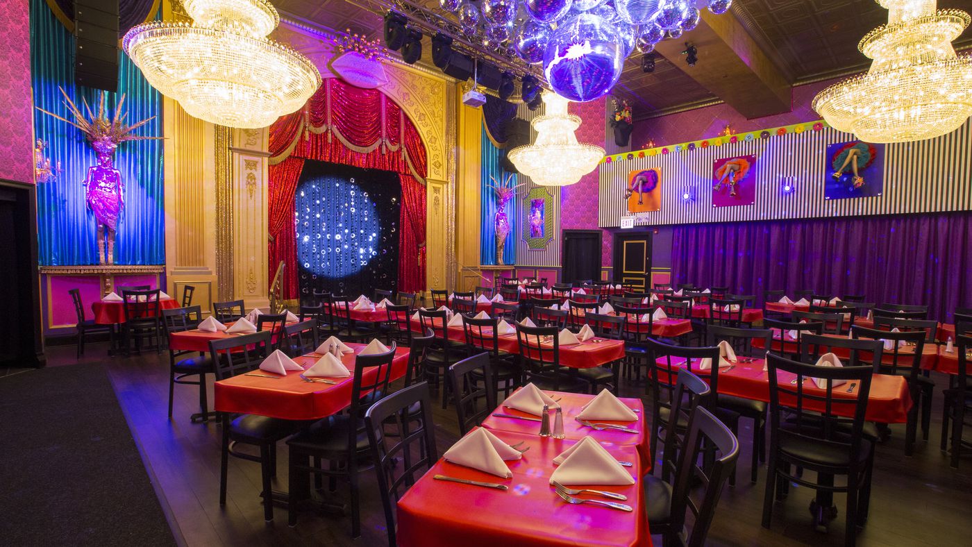 Vibrant event venue in San Diego with elegant chandeliers for banquets and performances.