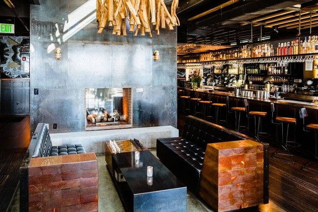 Crow's Nest at Kettner Exchange: modern venue with cozy fireplace for social events.