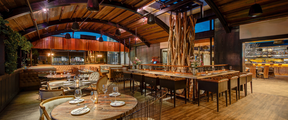 Stylish Harbor View Dining venue with warm wood accents for corporate events and gatherings.