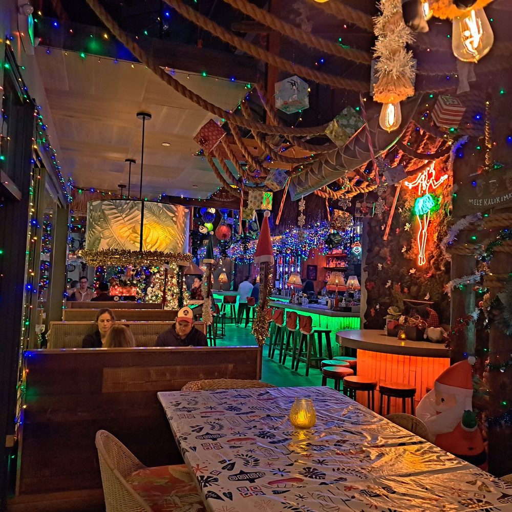 Vibrant indoor event space with holiday decor at Vistal Bar & Restaurant for gatherings.