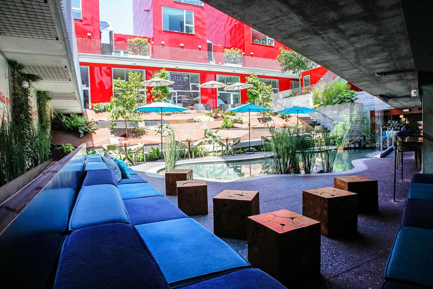 Vibrant outdoor lounge with pool, perfect for casual meetings and networking events.