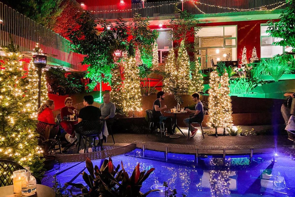 Vibrant outdoor dining space with festive lights for social gatherings and holiday parties.