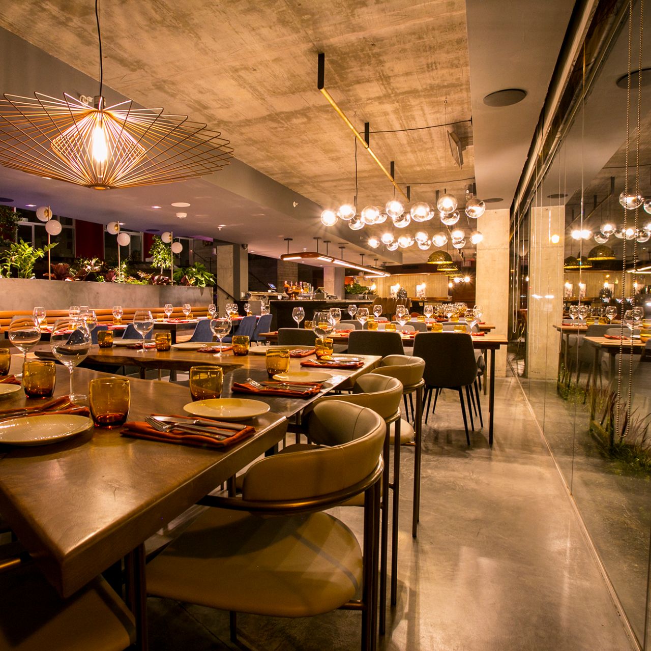 Modern dining room with elegant table settings for events and gatherings.