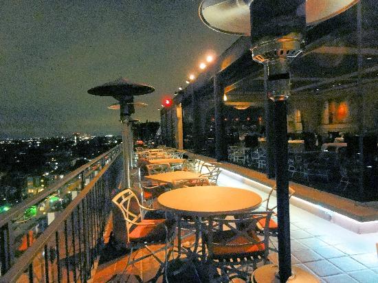 Stylish rooftop deck at Mister A's Restaurant, perfect for evening events and gatherings.