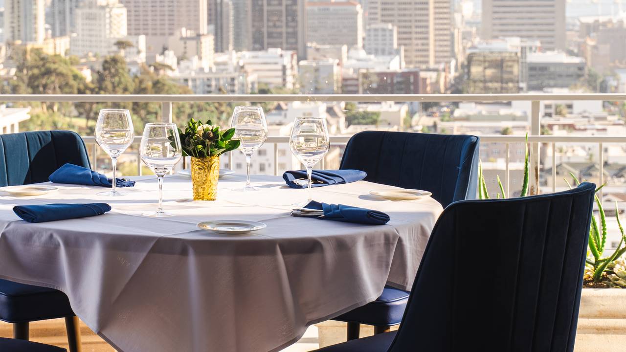 Formal dining area at Mister A's Restaurant with elegant table setting for corporate events.