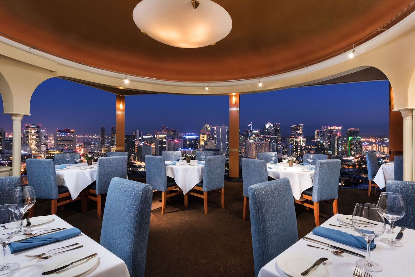 Elegant patio dining at Mister A's with skyline views, perfect for upscale events.