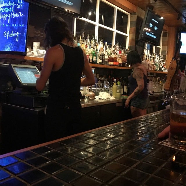 Lively indoor bar scene at Redwing Bar and Grill, perfect for events and networking.