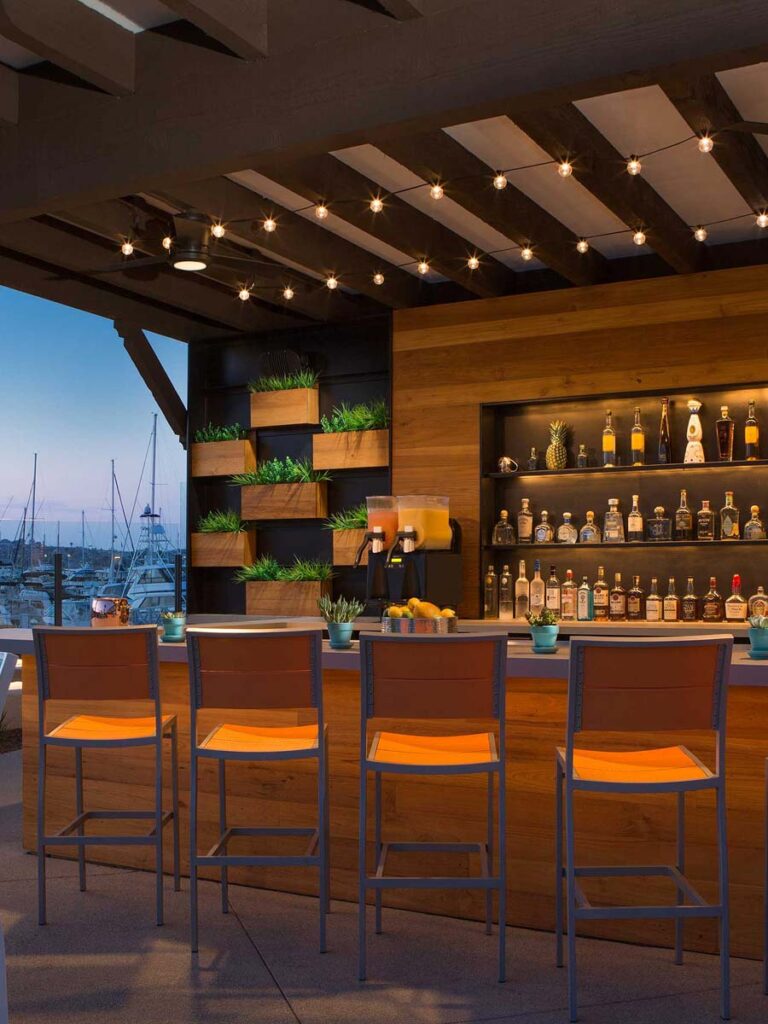 Stylish bar at Vessel Restaurant with wooden accents, ideal for networking events and cocktail receptions.