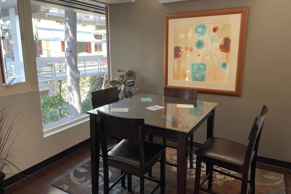 Brown Meeting Room with glass table, ideal for intimate gatherings and brainstorming sessions.