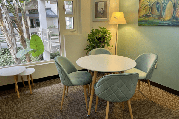 Cozy Brown Meeting Room with round table for intimate gatherings and workshops.