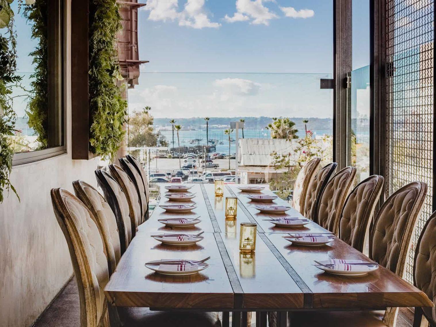 Elegant dining table at Sufigrill for private events with waterfront view.