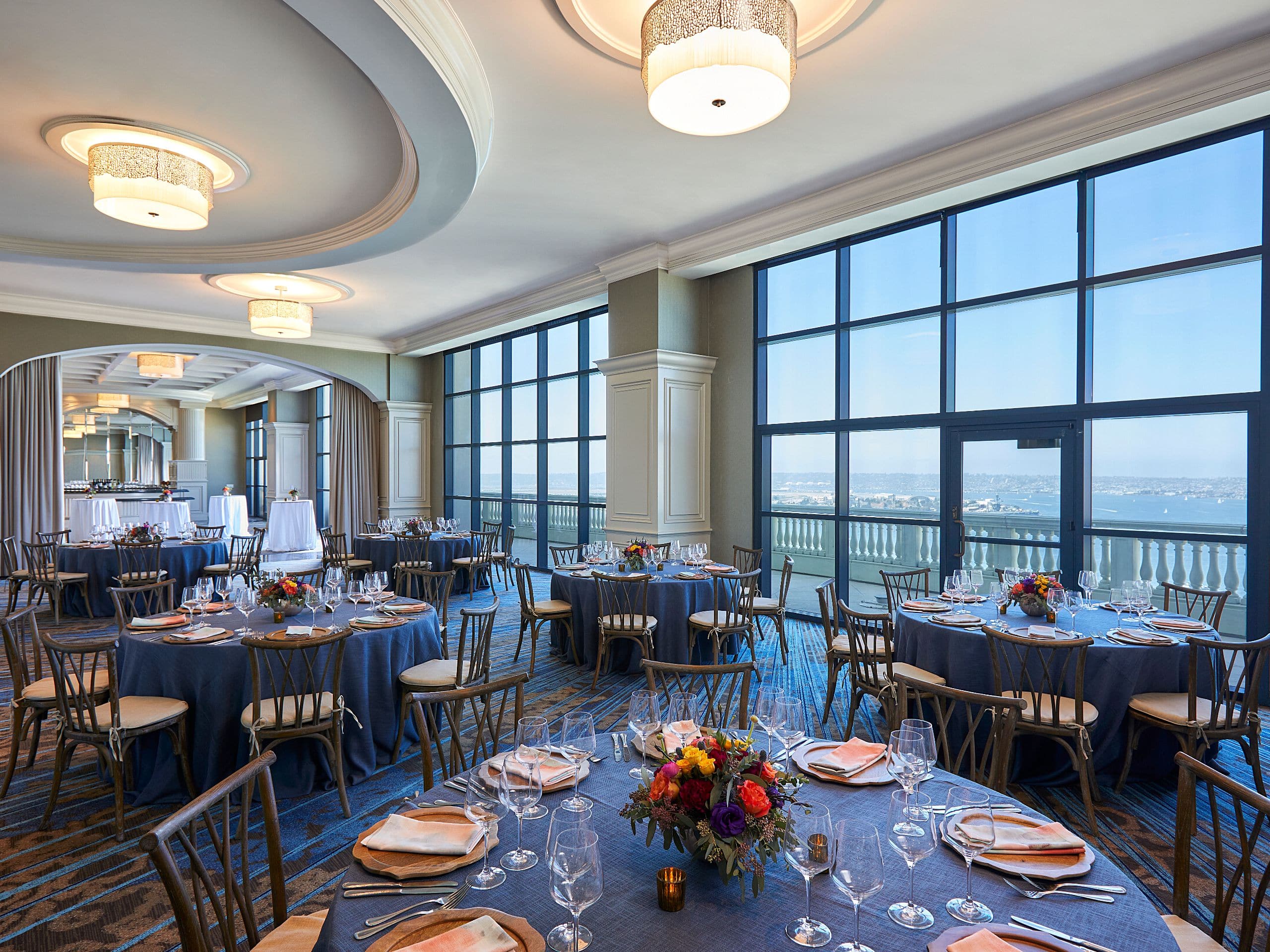 Elegant event space in San Diego with round tables, perfect for weddings and corporate events.