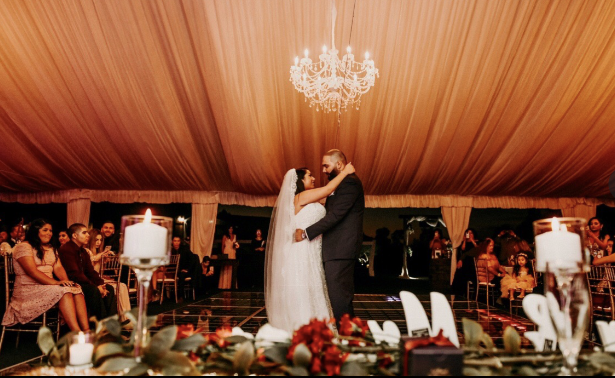 Elegant wedding reception gazebo in San Diego with romantic lighting and floral decor.