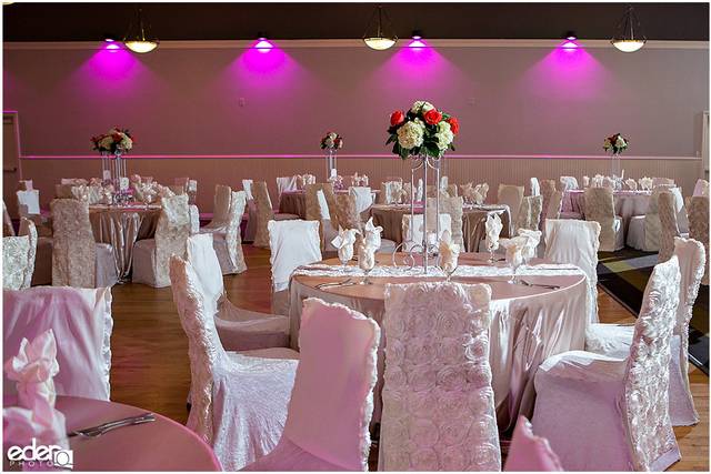 Elegant ballroom with pink decor, perfect for weddings and formal events.