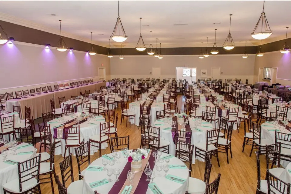 Spacious Swiss Park event hall with elegant tables, perfect for weddings and banquets.