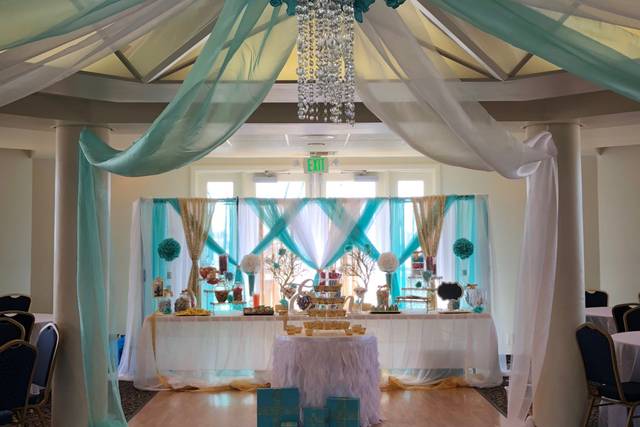 Elegant Bayside Pavilion with turquoise drapery, perfect for weddings and upscale parties.