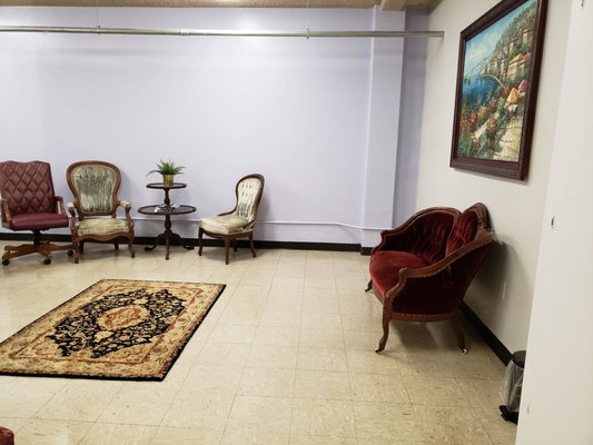 Private office waiting area with elegant seating for networking events and meetings.