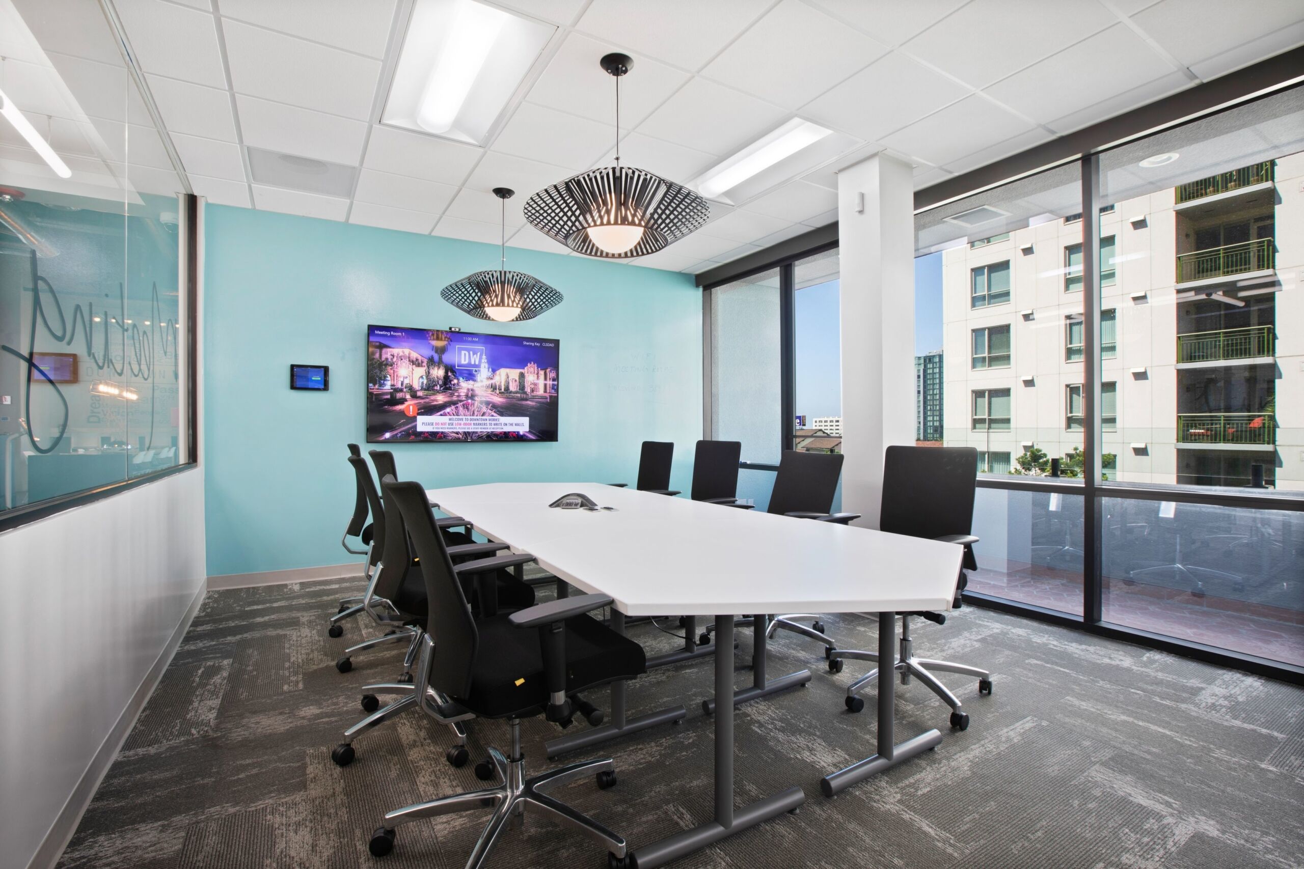 Modern conference room with sleek table, ideal for collaborative meetings and brainstorming.