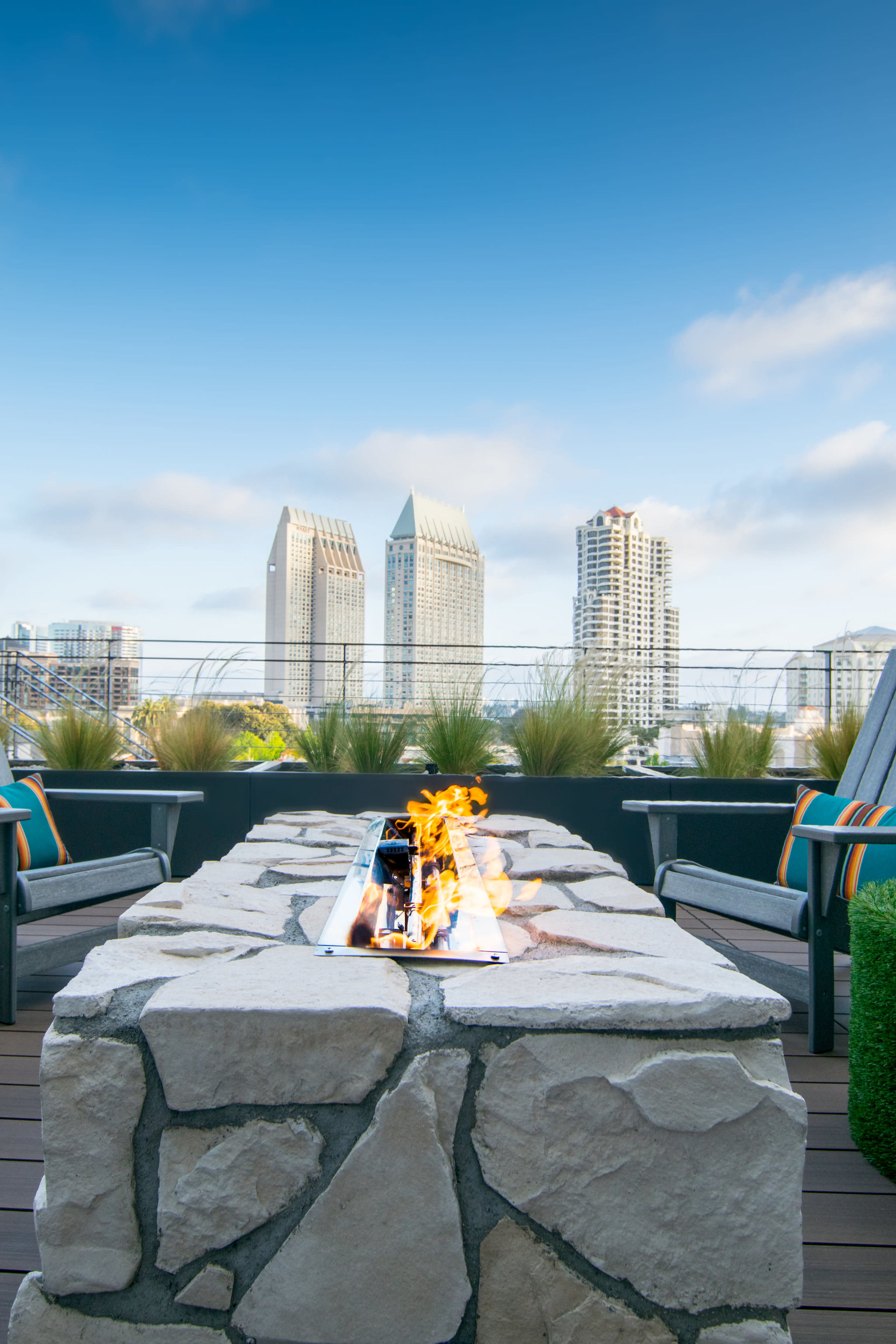 Rooftop venue with modern fire pit, ideal for networking events and gatherings.