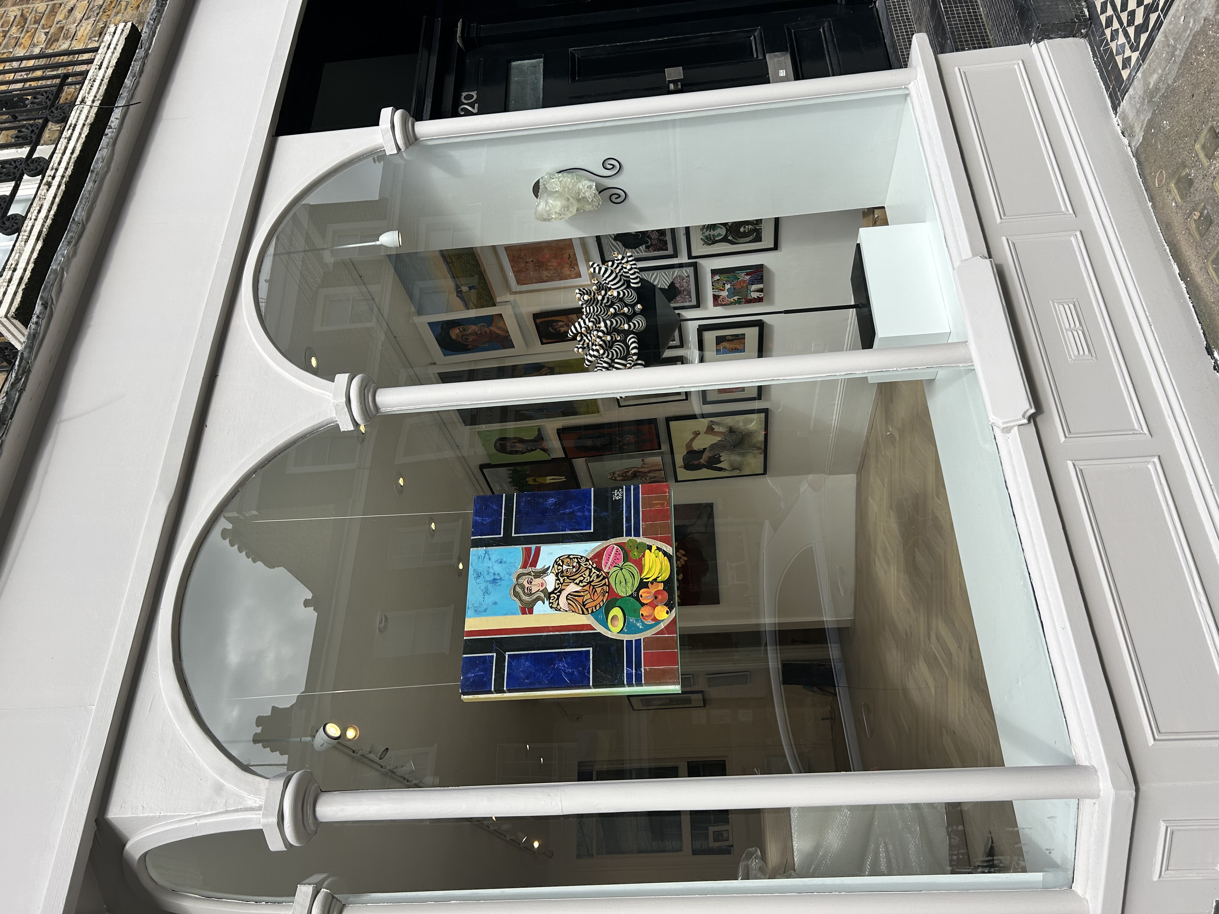 Vibrant art gallery space with colorful artwork, ideal for events and exhibitions.