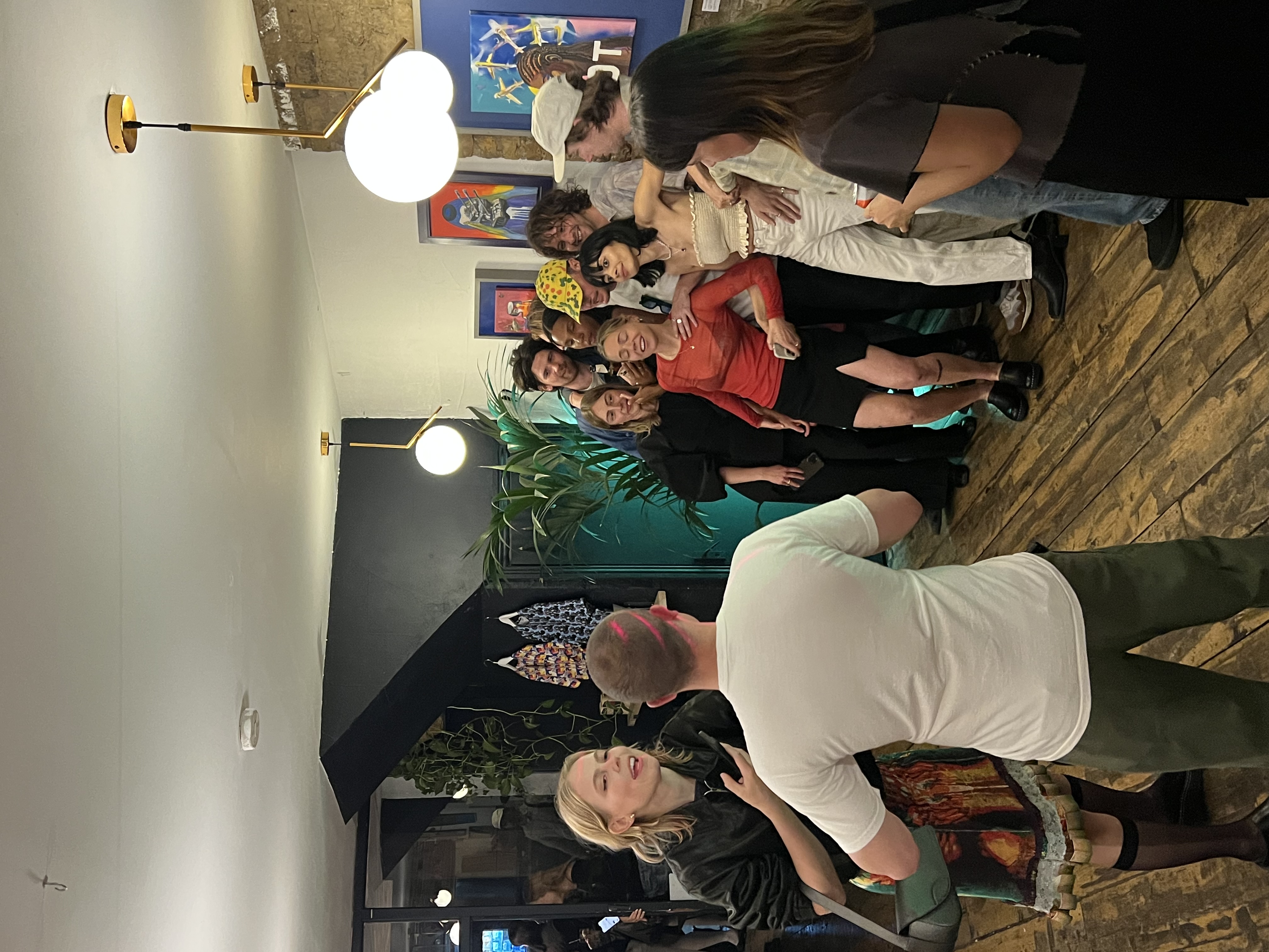 Vibrant networking event at Mosaic Clapton Wine Bar with diverse attendees and modern decor.