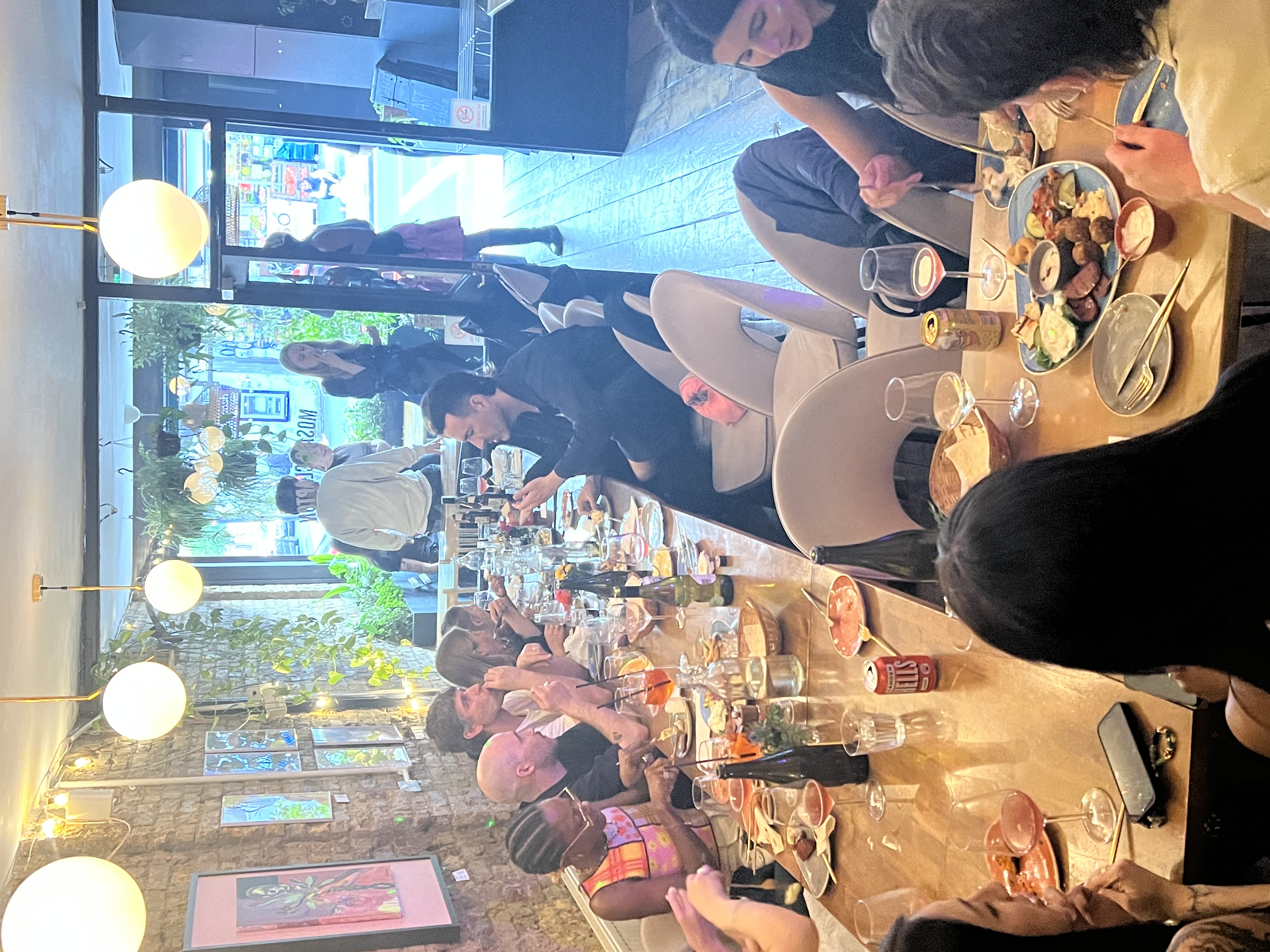 Mosaic Clapton Wine Bar dining event with guests enjoying food and drinks, perfect for celebrations.