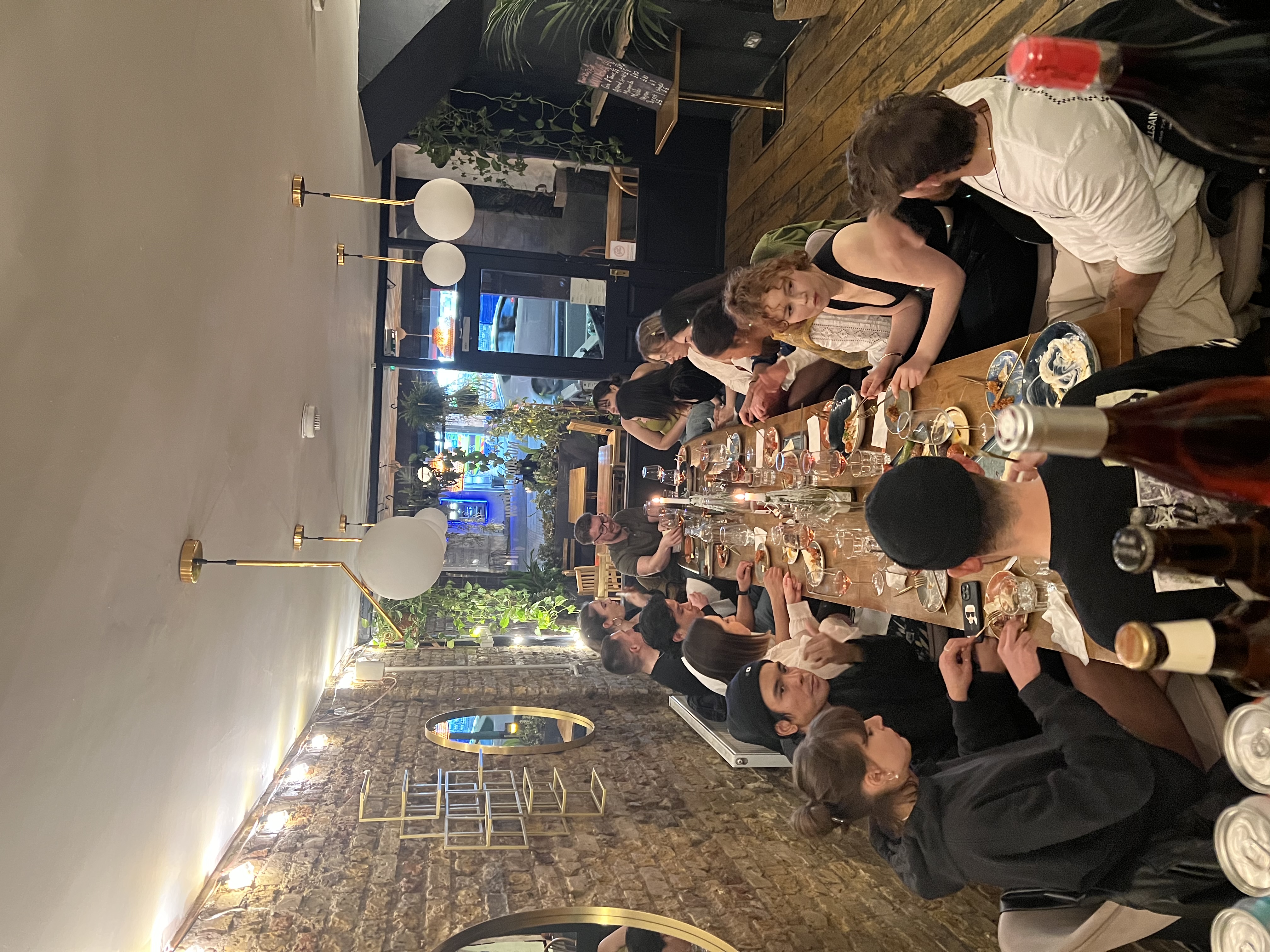 Lively group dining at Mosaic Clapton Wine Bar, ideal for networking and team-building.