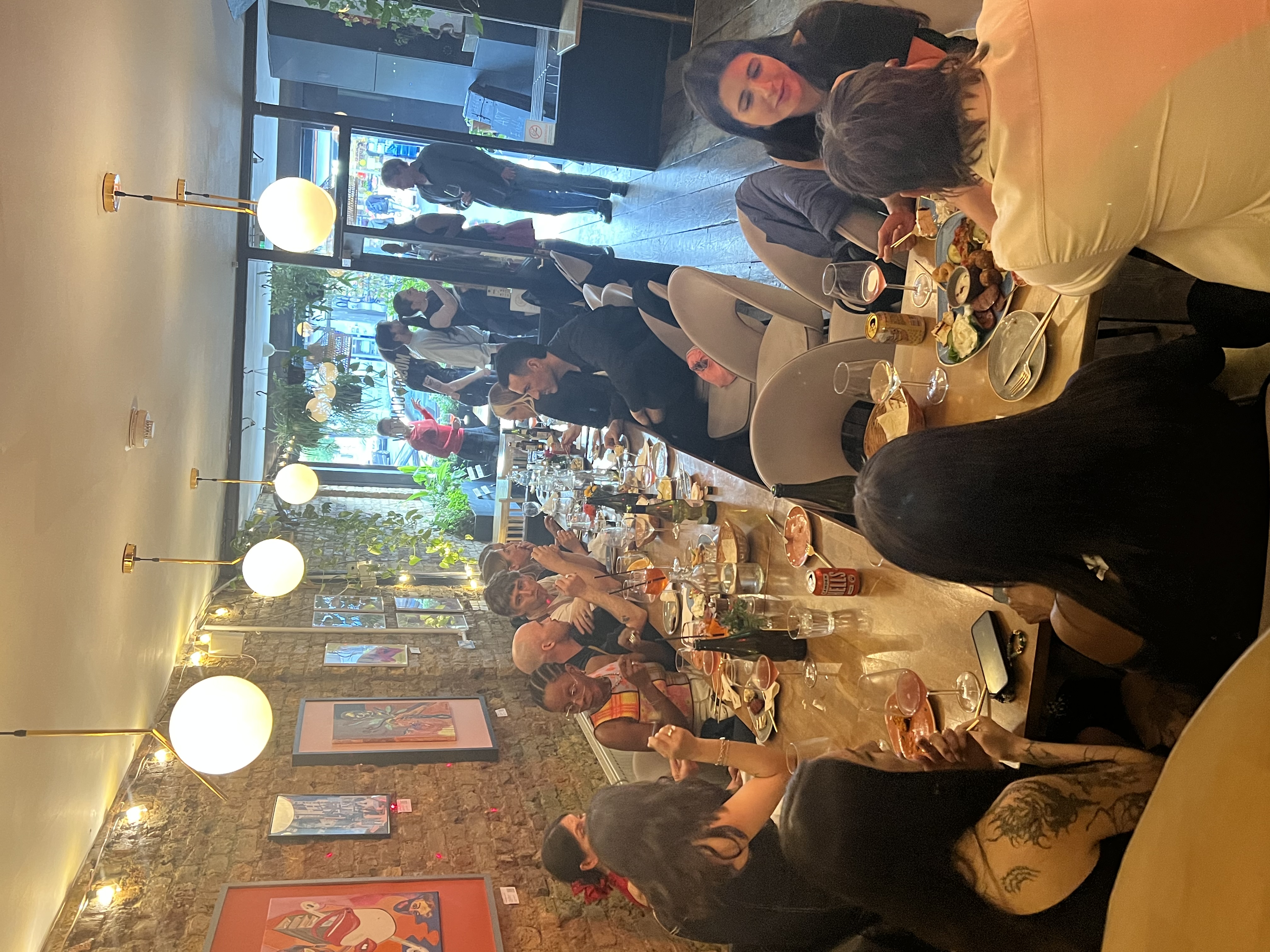 Mosaic Clapton Wine Bar dinner event with guests enjoying food and drinks, ideal for networking.