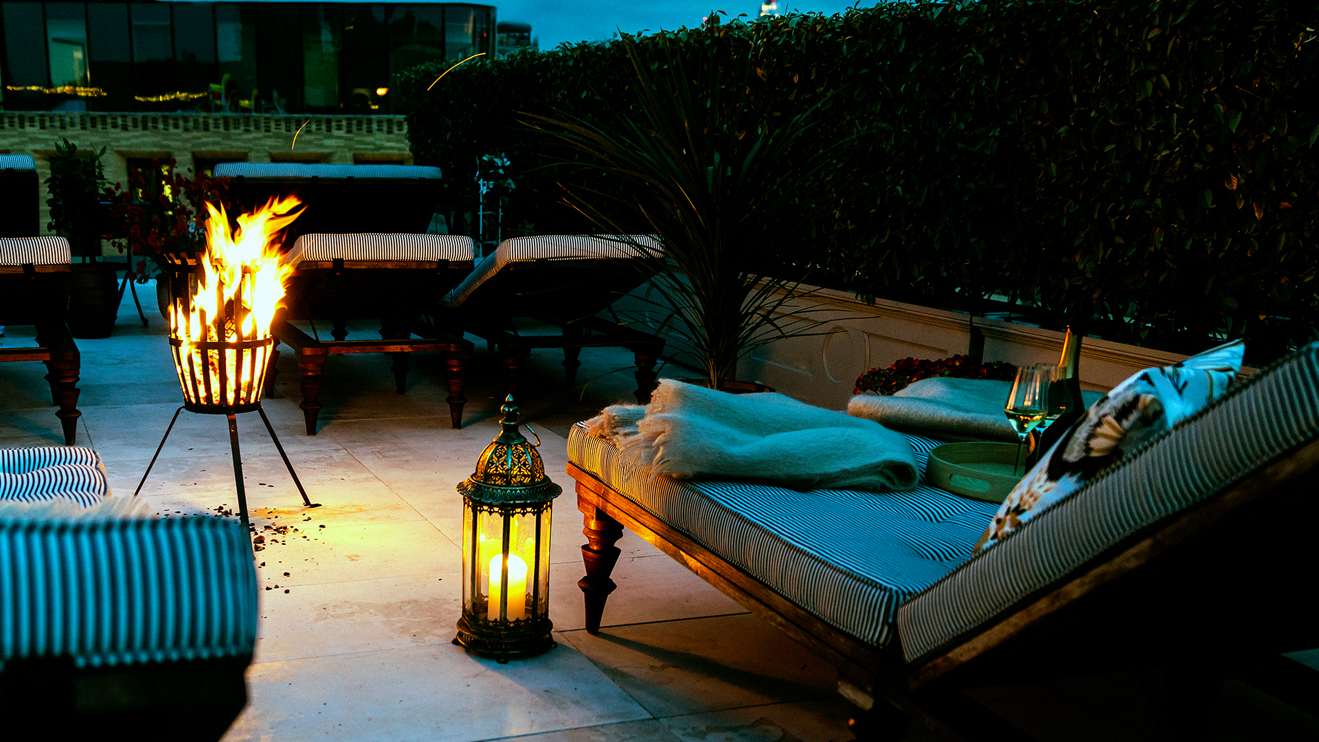 Stylish rooftop lounge with fire, ideal for upscale events and networking.