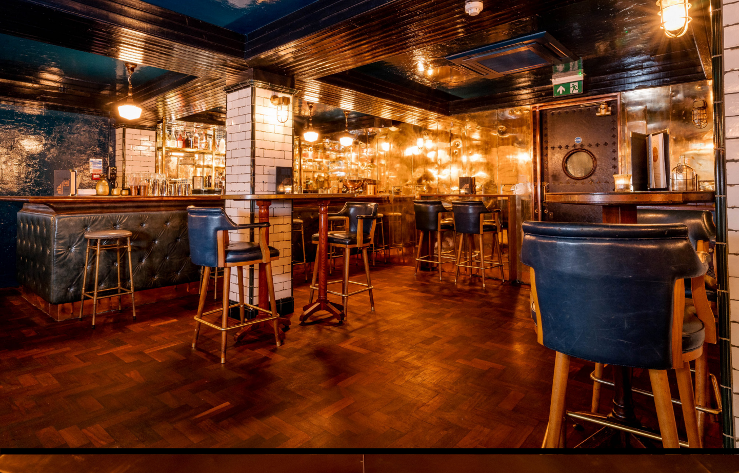 Stylish Spitalfields Bar with warm lighting, perfect for networking events and gatherings.