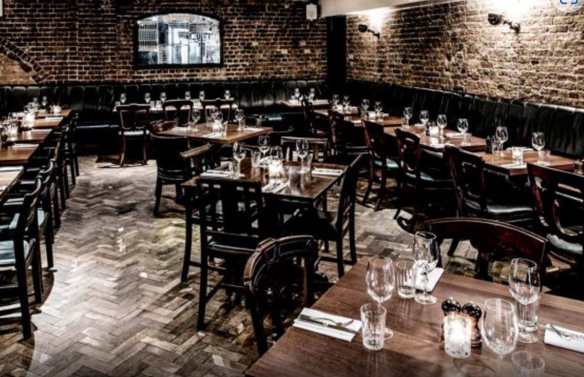 Vesta Tilley Dining Room: cozy restaurant with warm brick walls for intimate events.