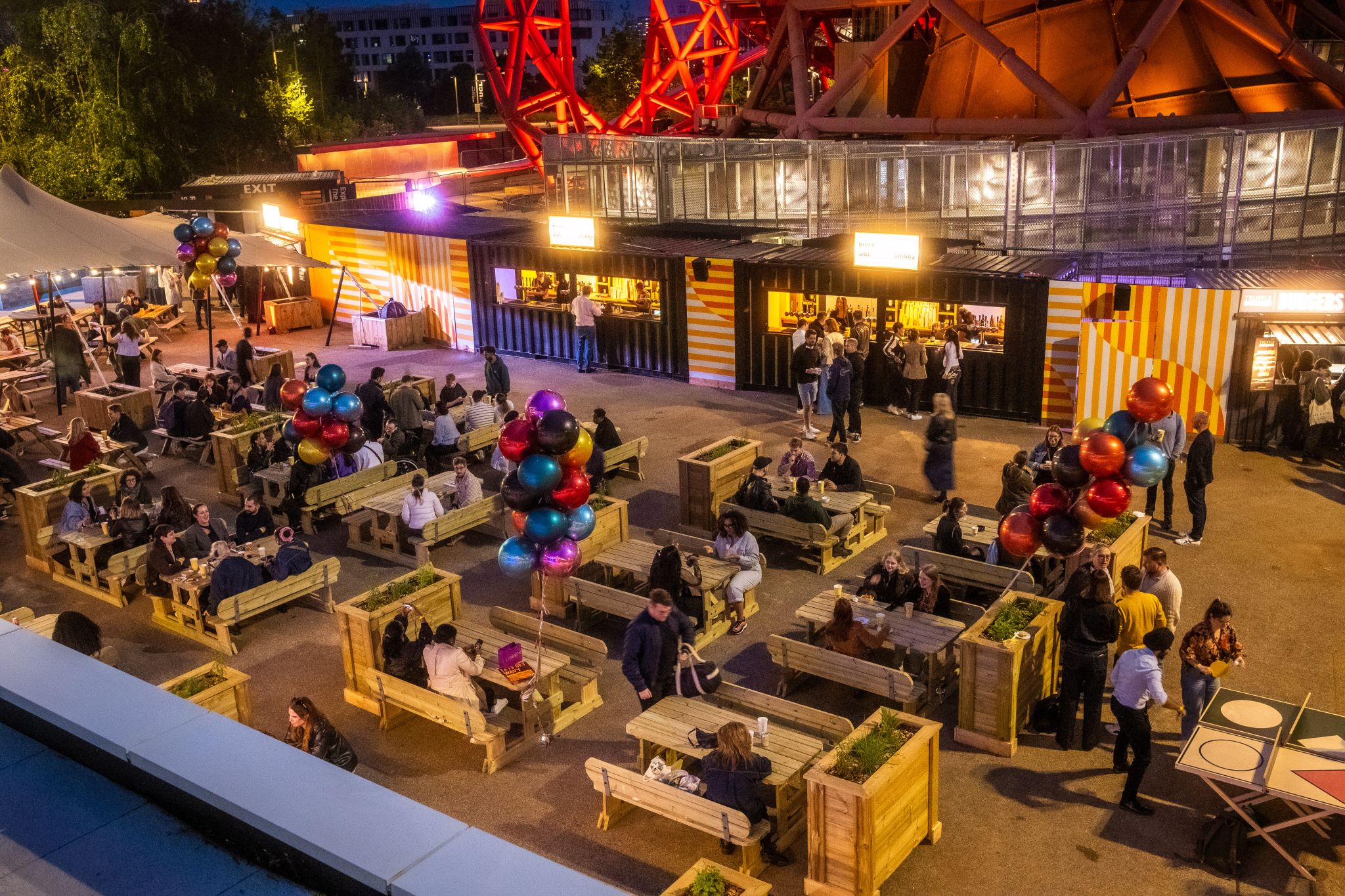 Vibrant outdoor event space with colorful balloons for networking and gatherings.