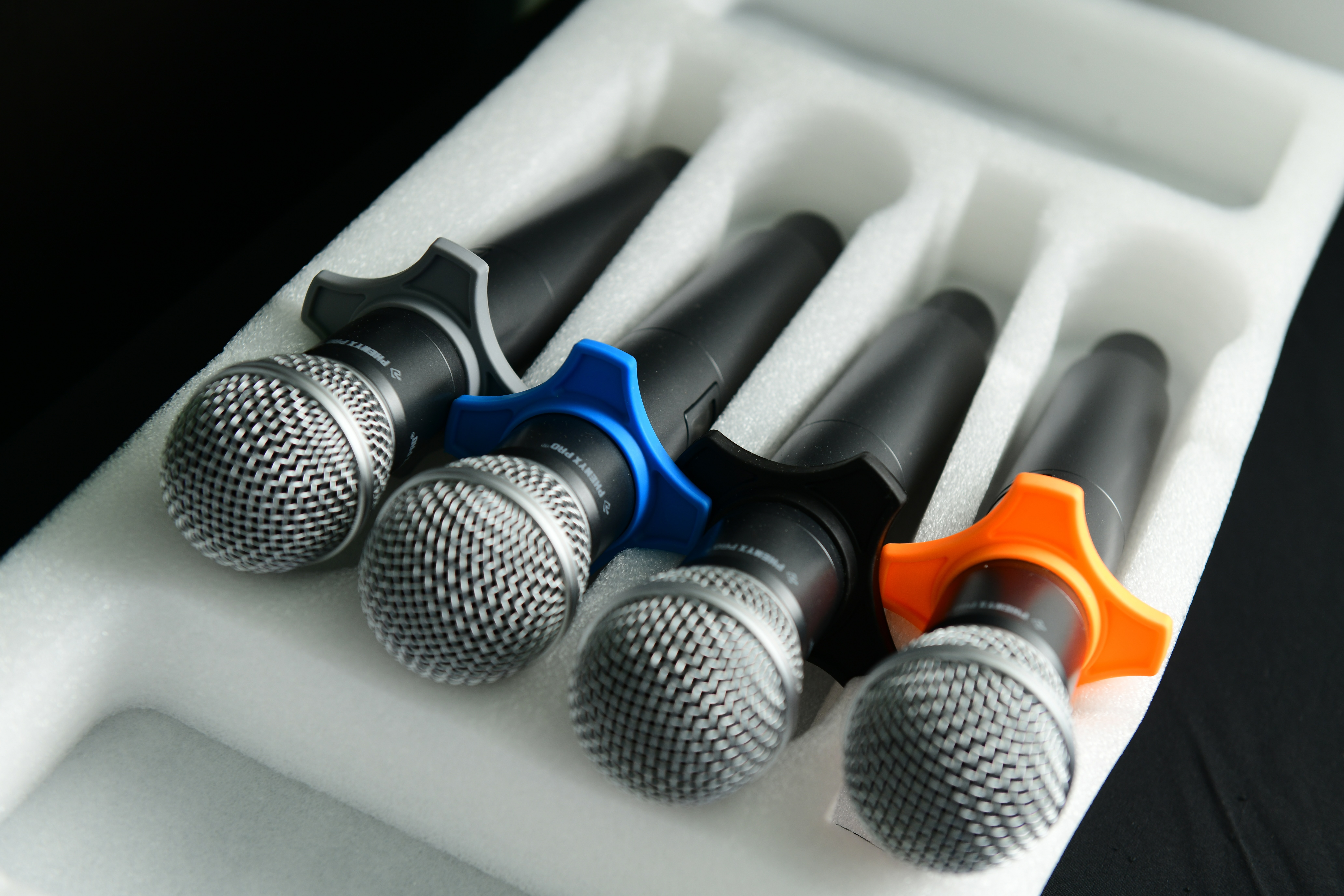 Conference room with four color-coded microphones for effective presentations and events.
