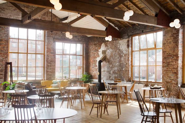 Stylish bakery event space with exposed brick, ideal for networking and workshops.