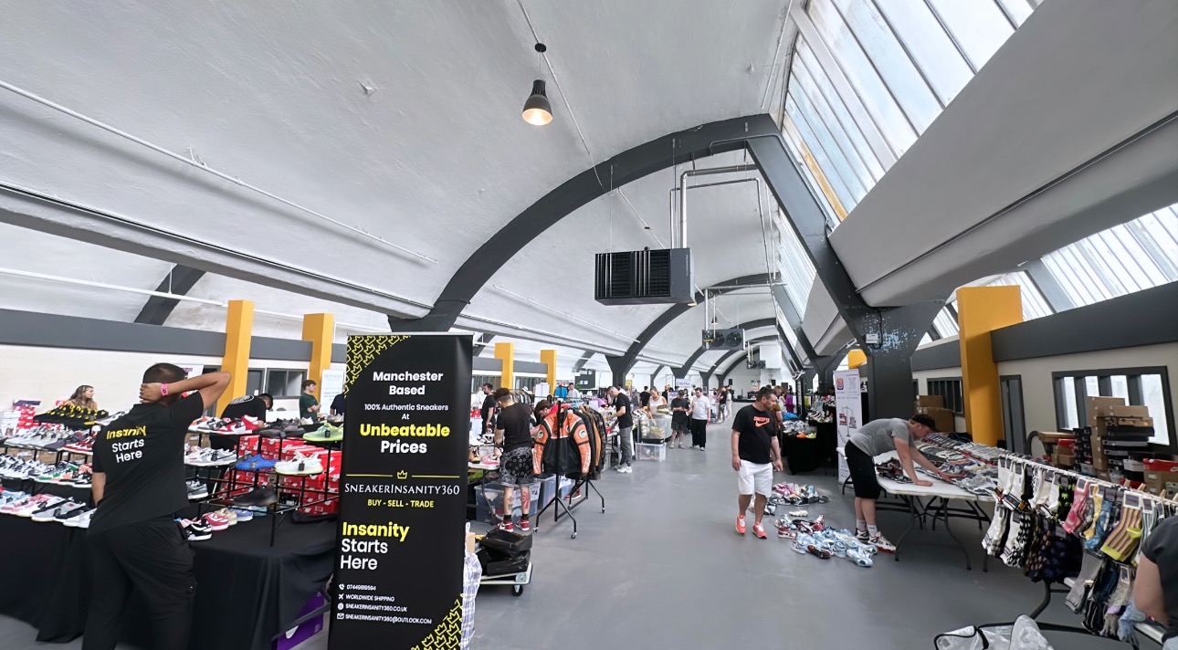 Vibrant Box Hub Warehouse event space with vendor booths for networking and sales.