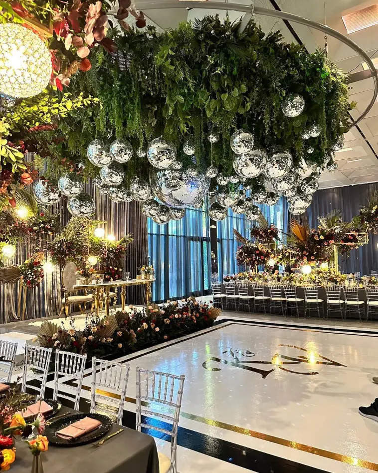 Elegant event space with lush greenery, ideal for weddings and corporate gatherings.