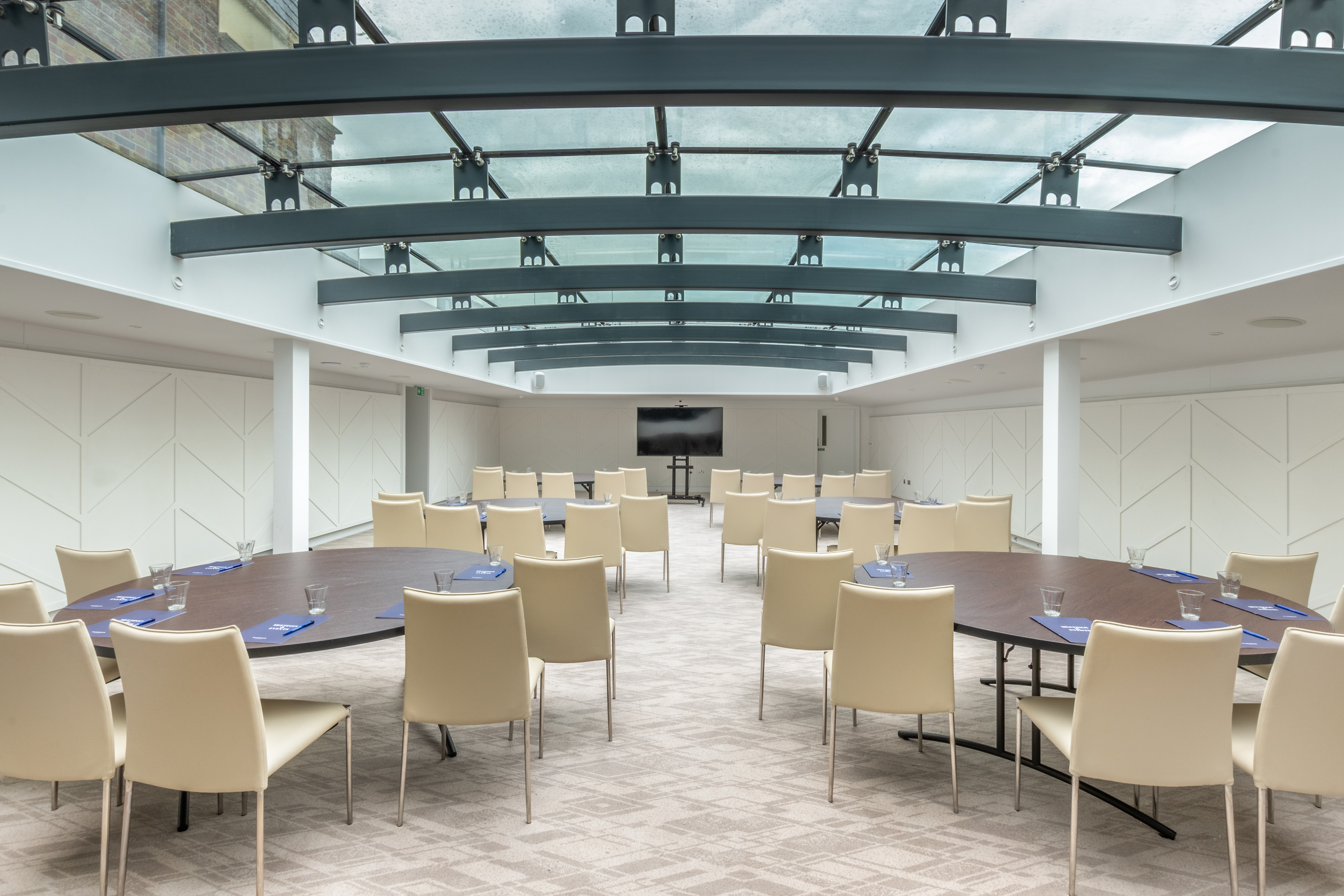 Orion Suite at Richmond Harbour Hotel: modern meeting space with natural light, ideal for workshops.