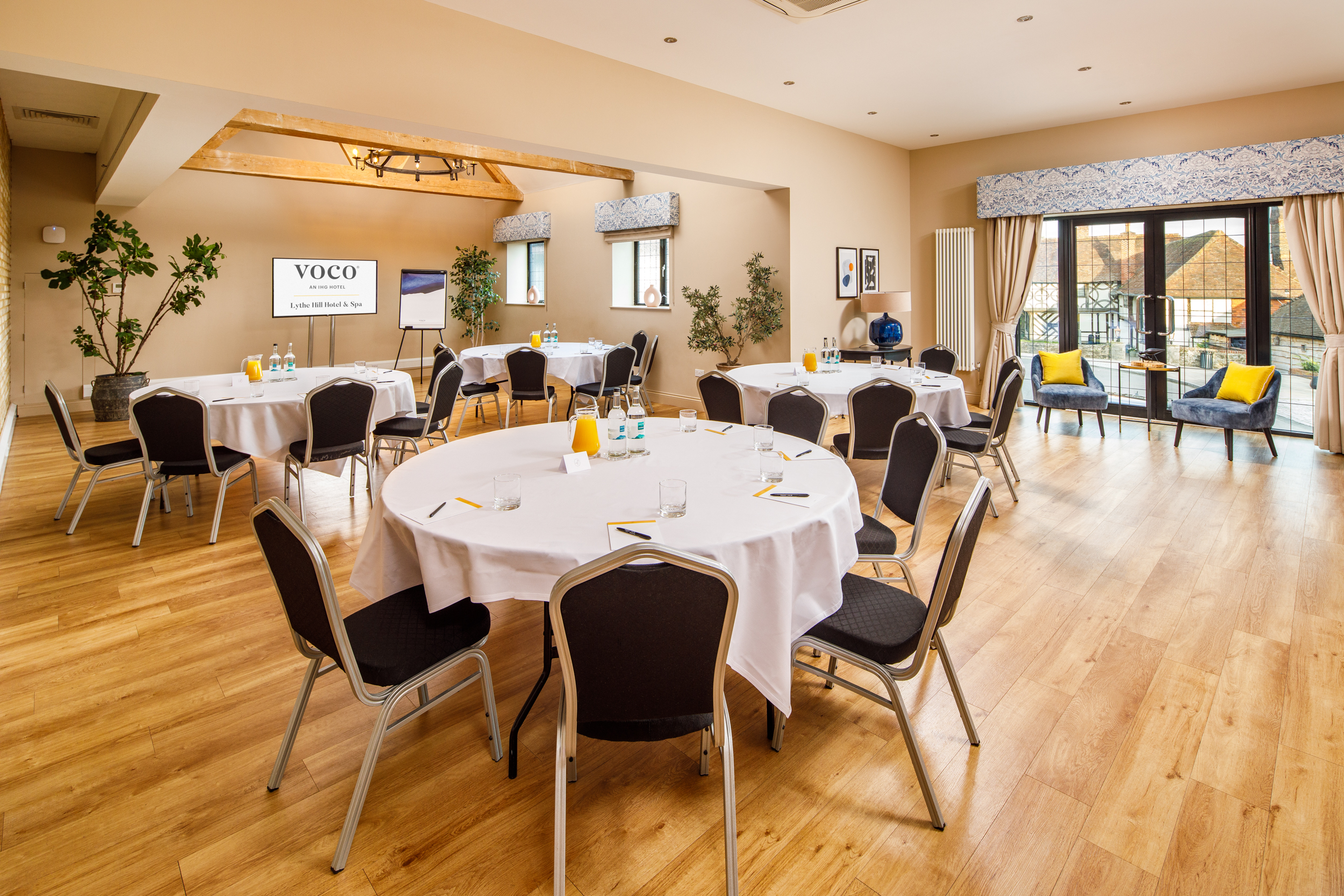 Cedar Suite at Voco Lythe Hill: elegant meeting space for conferences and workshops.