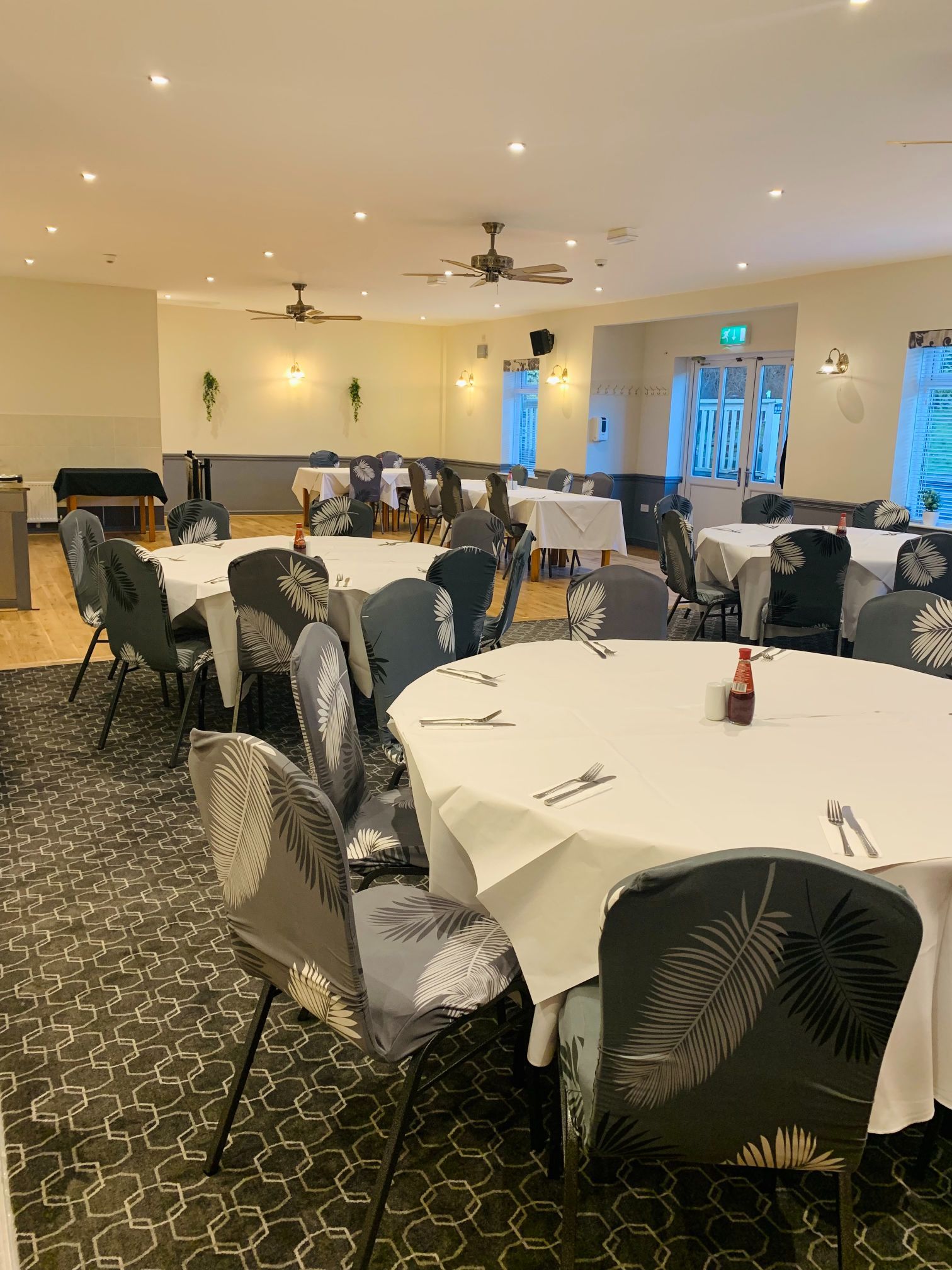 Function Room at The Sportsman Pub with elegant round tables for events and gatherings.