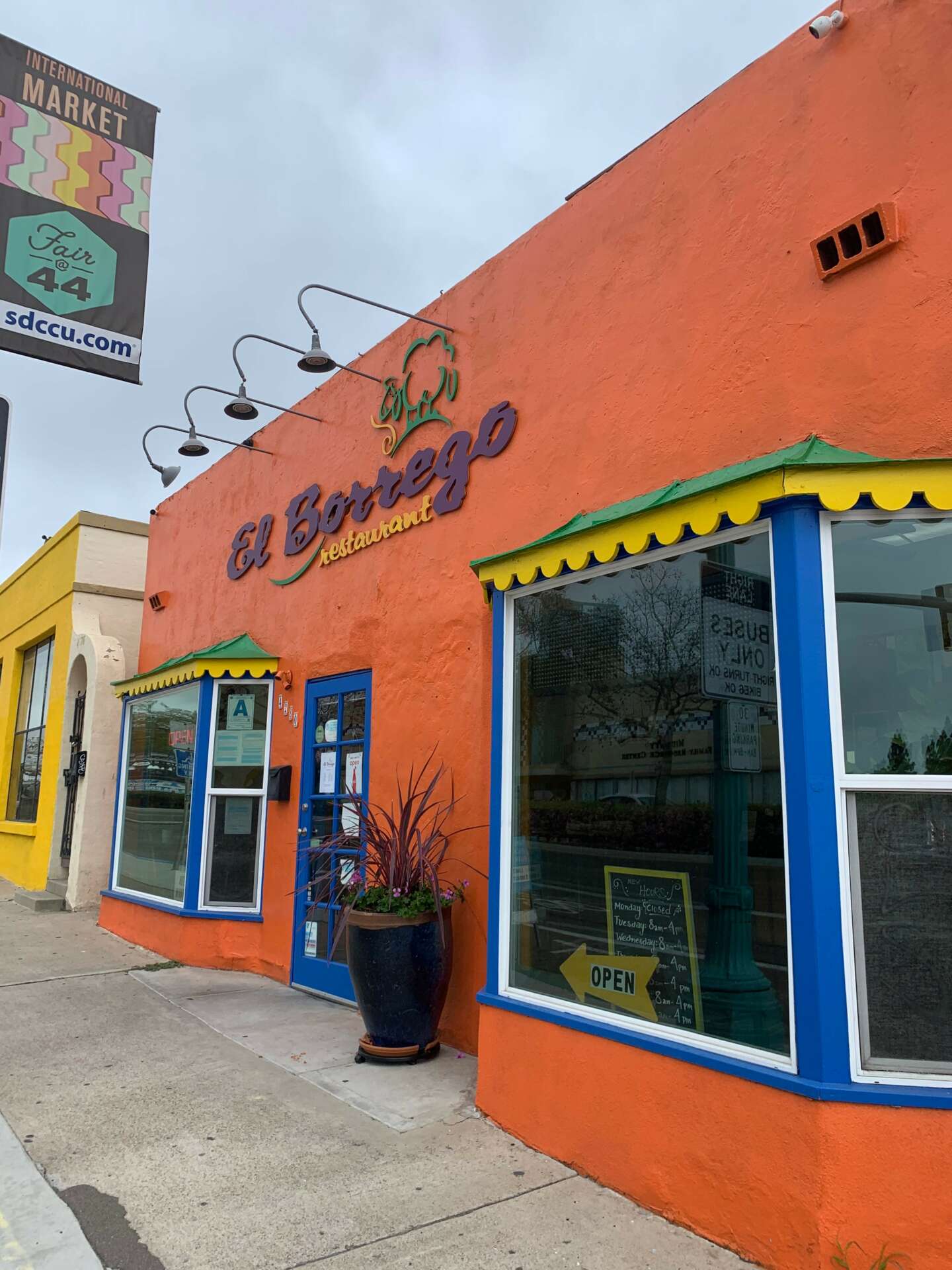 Outdoor patio at JC Bruno Restaurant, colorful facade ideal for casual events and meetings.