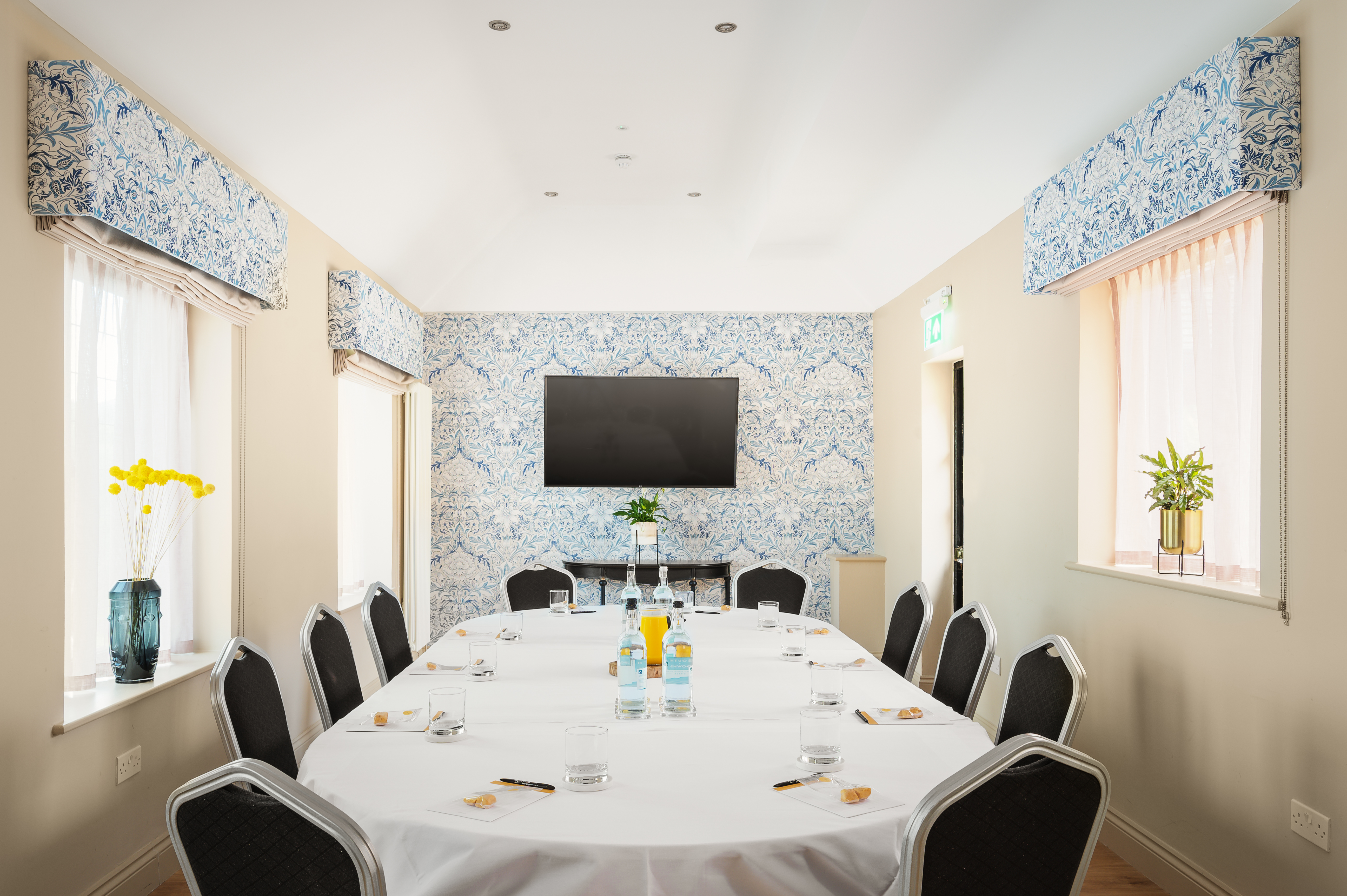 Willow Suite at Voco Lythe Hill: elegant meeting room for workshops and strategy sessions.