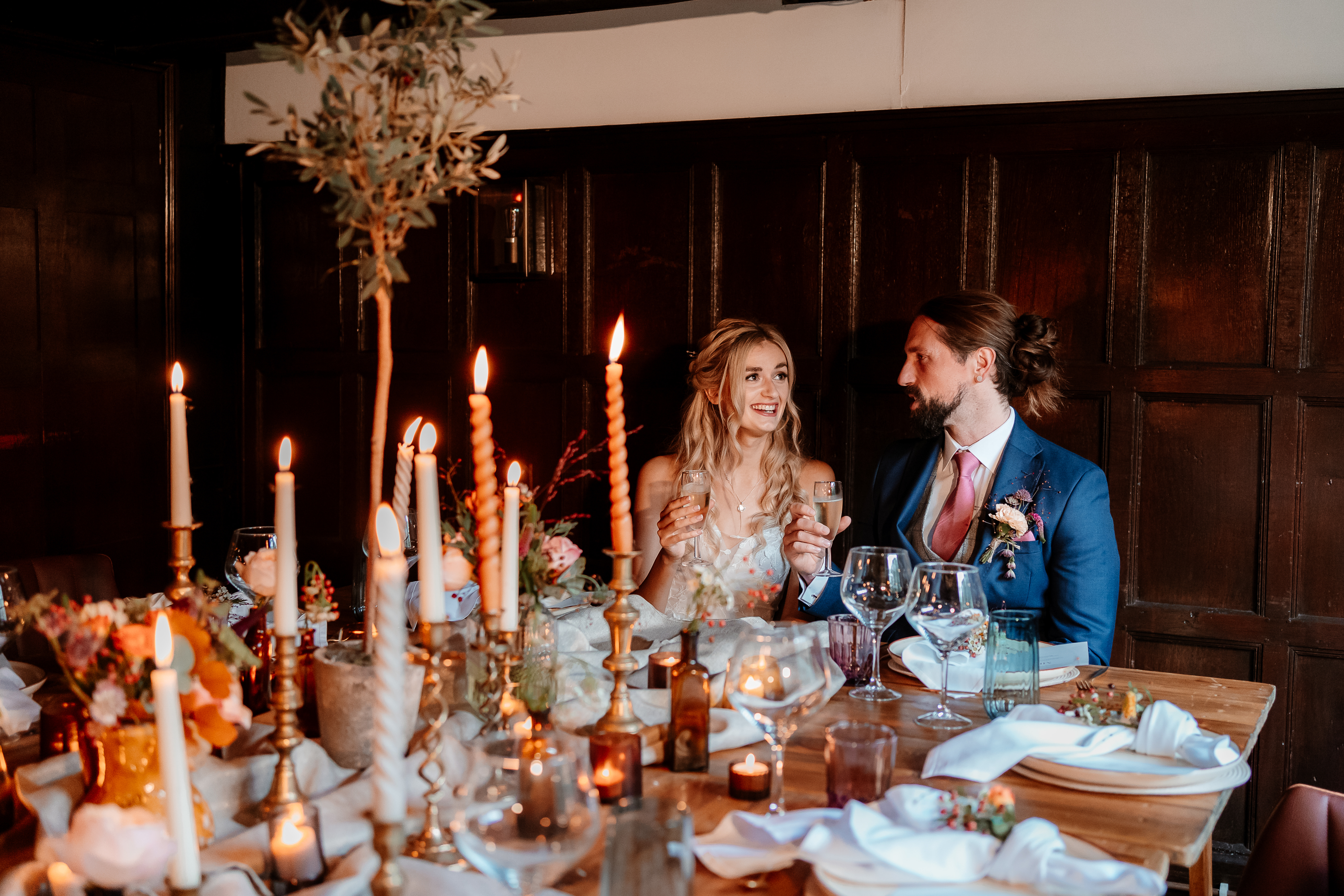 Intimate wedding reception in The Oak Room, Voco Lythe Hill Hotel & Spa, elegant decor.