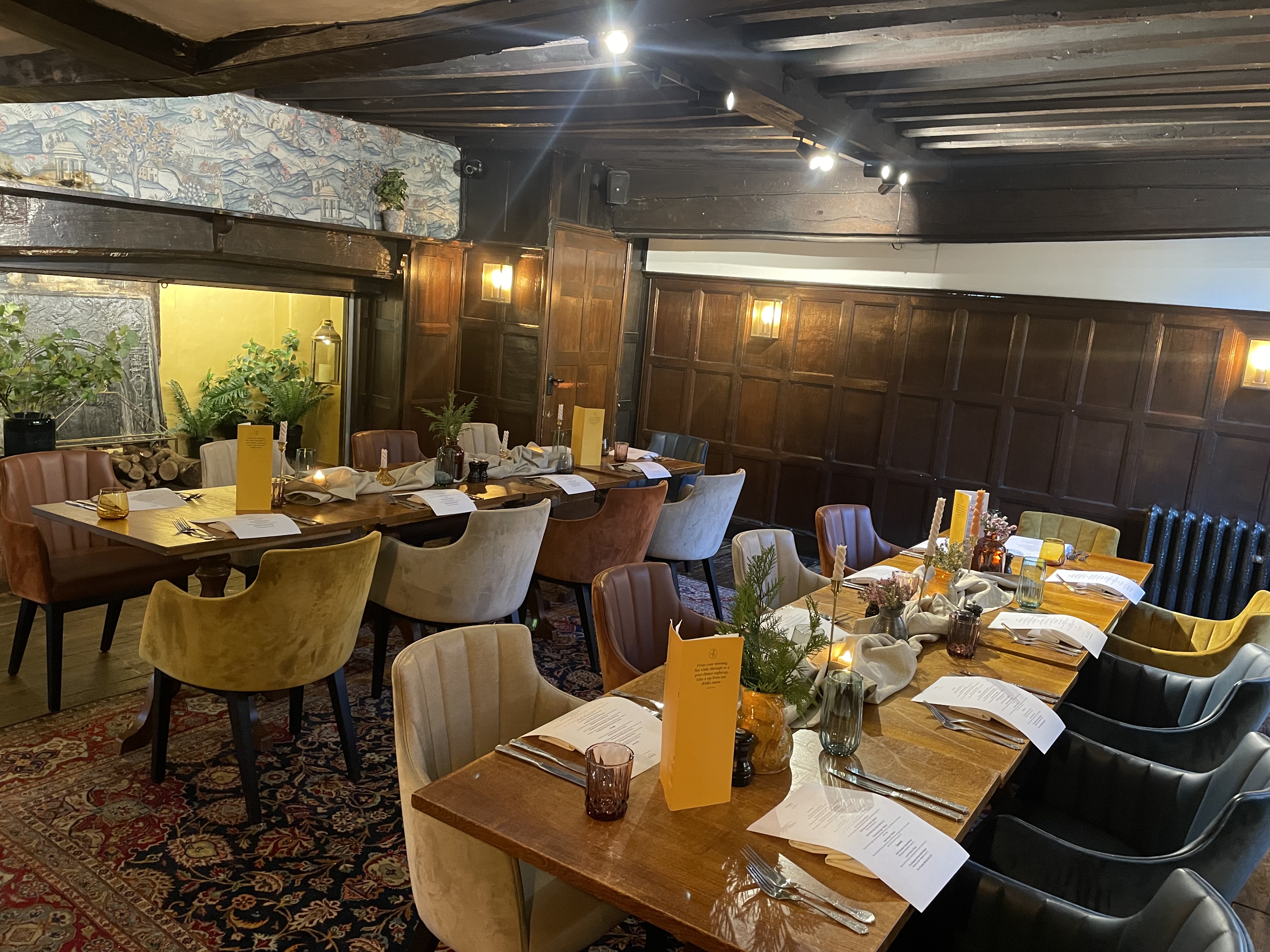 Private dining in The Oak Room at Voco Lythe Hill Hotel, ideal for gatherings and meetings.