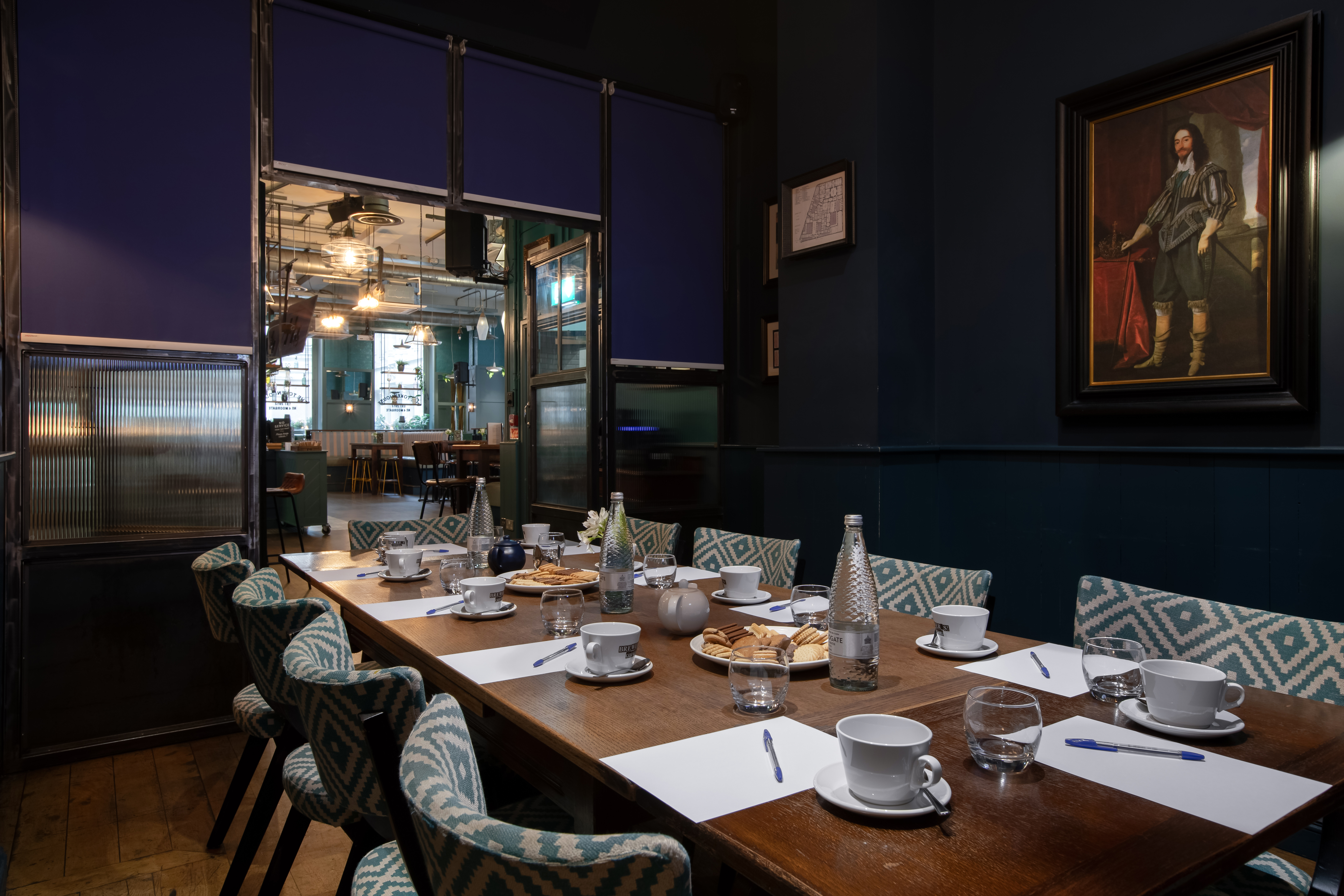 Intimate meeting room with wooden table, ideal for professional gatherings and events.