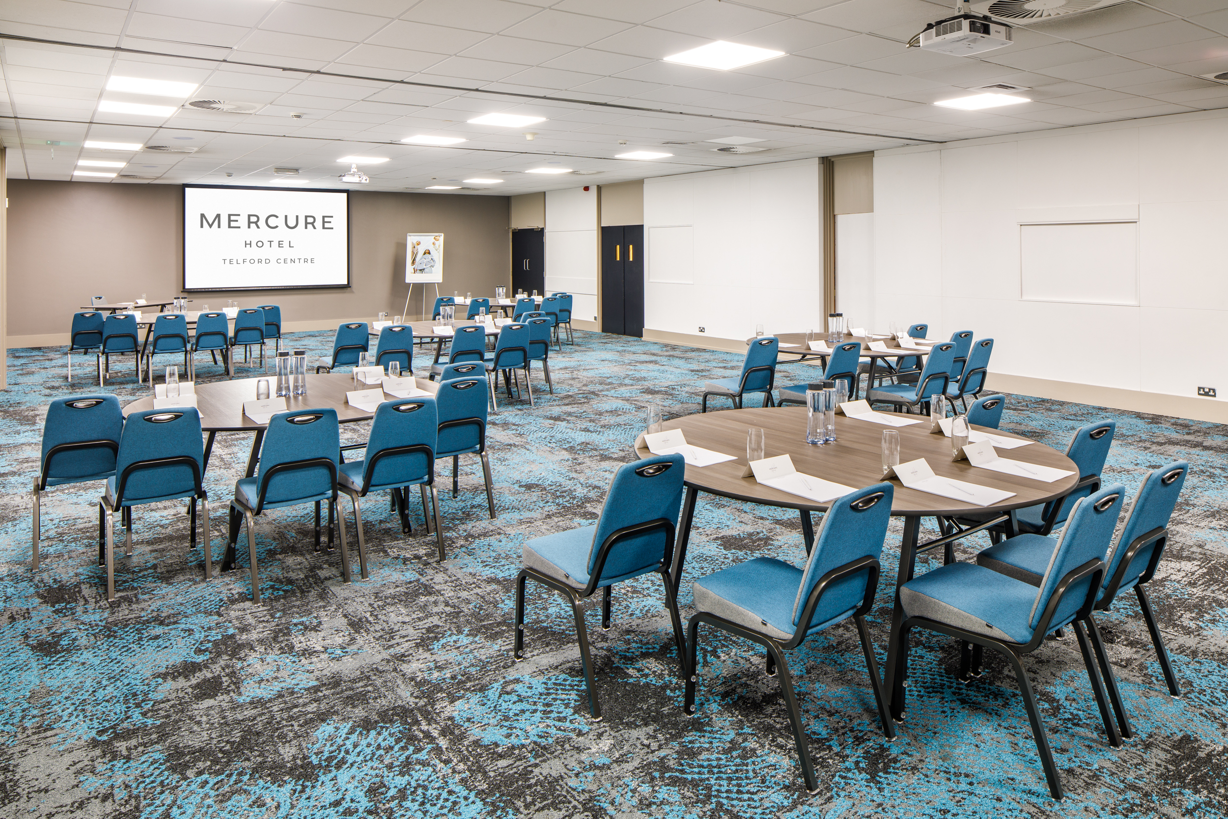 Ironbridge Suite meeting room with round tables, ideal for conferences and workshops.