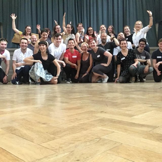 Vibrant dance school event with diverse participants celebrating community and collaboration.