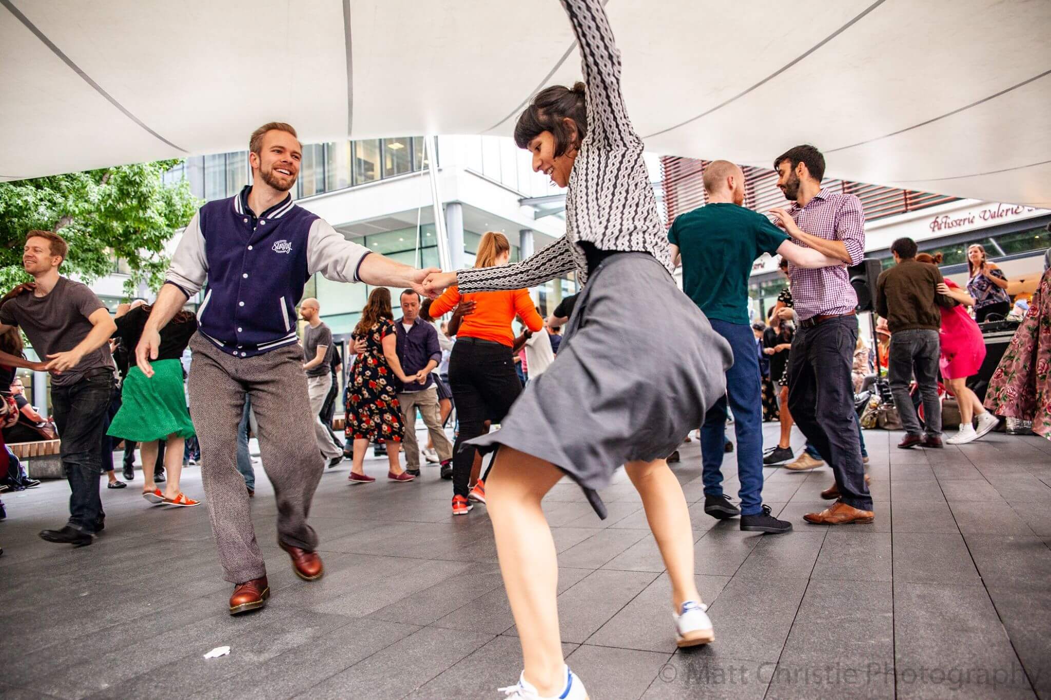 Outdoor dance event at Swing Patrol with lively movement and community engagement.