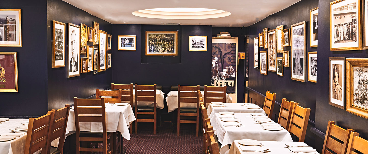 Cozy dining space in Punjab Restaurant, ideal for private events and networking dinners.