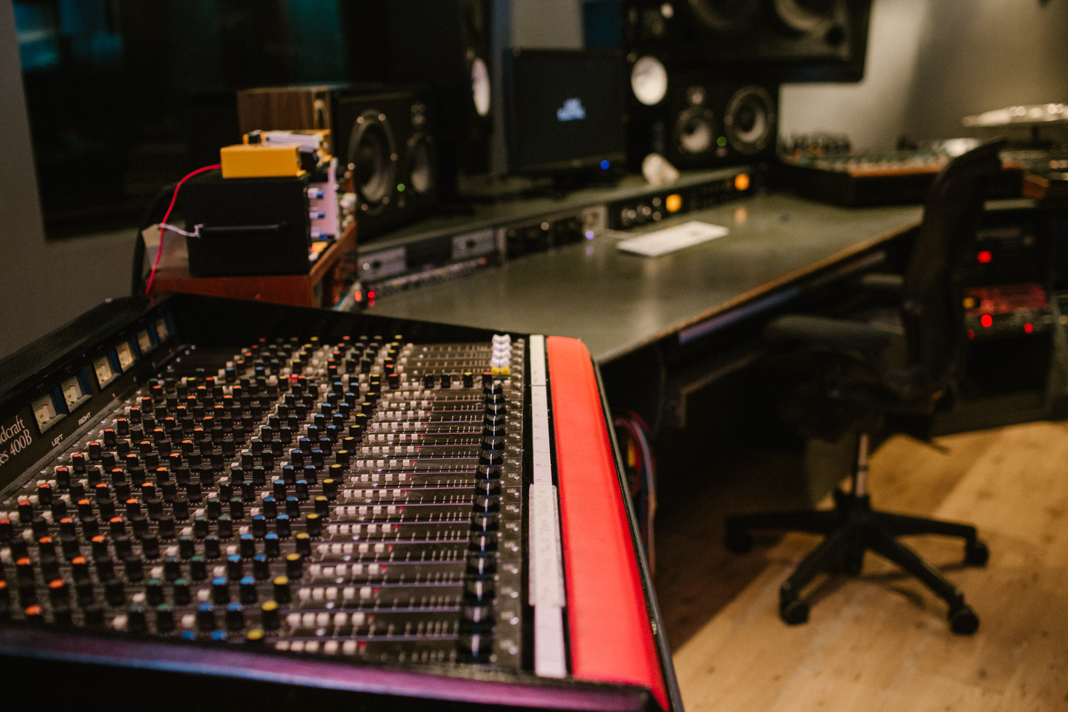 Professional audio mixing studio with advanced equipment for live performances and conferences.