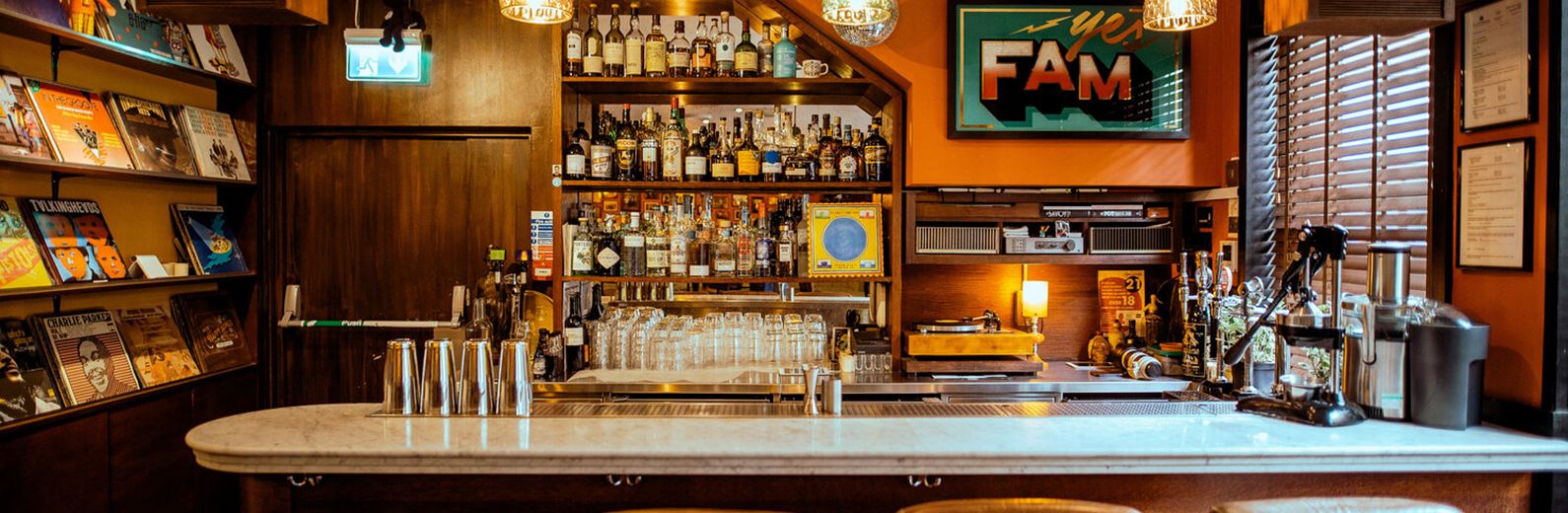 "FAM Bar with warm lighting, ideal for networking events and gatherings in Oxford Street."